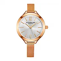 Relgio feminino Stuhrling com moldura e ponteiros em ouro rosa e mostrador prateado.