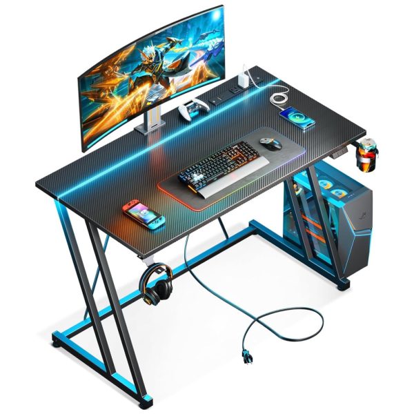 ectq8hj4wlgc0b_0 jpg - Mesa Gamer 39 99 cm com Textura de Fibra de Carbono, Gancho para Fone de Ouvido, Tomadas, 1 Portas USB e Luz LED, 110V, MOTPK, Preto