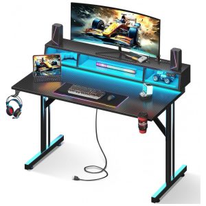 Mesa Gamer MOTPK 102 cm Preto com Suporte Monitor Flutuante LED Tomadas USB e Estrutura em T Textura Fibra Carbono Compacta